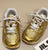 Gold Mini Tega Sneakers